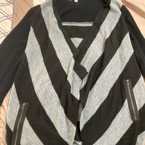 Open black and gray striped sweater with zipper features. Small.